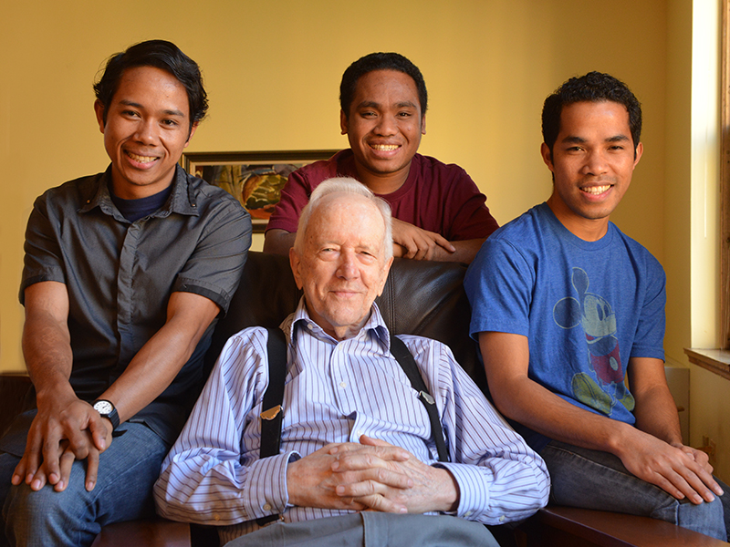 Father Michael Gantley visits with members in formation. From left: Brother Leo Hambur, Brother Sebastian Mulu (standing), Father Michael Gantley, and Brother Eric Tajung.